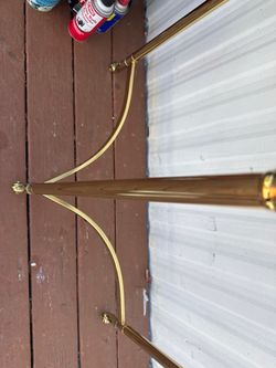 a vintage LaBarge style Hollywood Regency demilune brass and glass console table