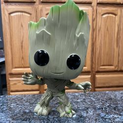 Funko pop Guardians of the Galaxy Super Sized Baby Groot- #202.  Size 10 inches tall.  Preowned Excellent Condition.  Has been on display in a cabinet