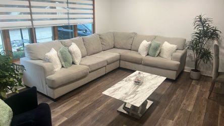 sofa L shape in good condition color beige