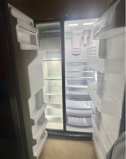 GE side by side refrigerator with water dispenser.