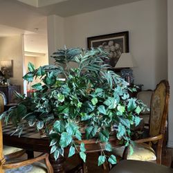 Artificial green plants in basket