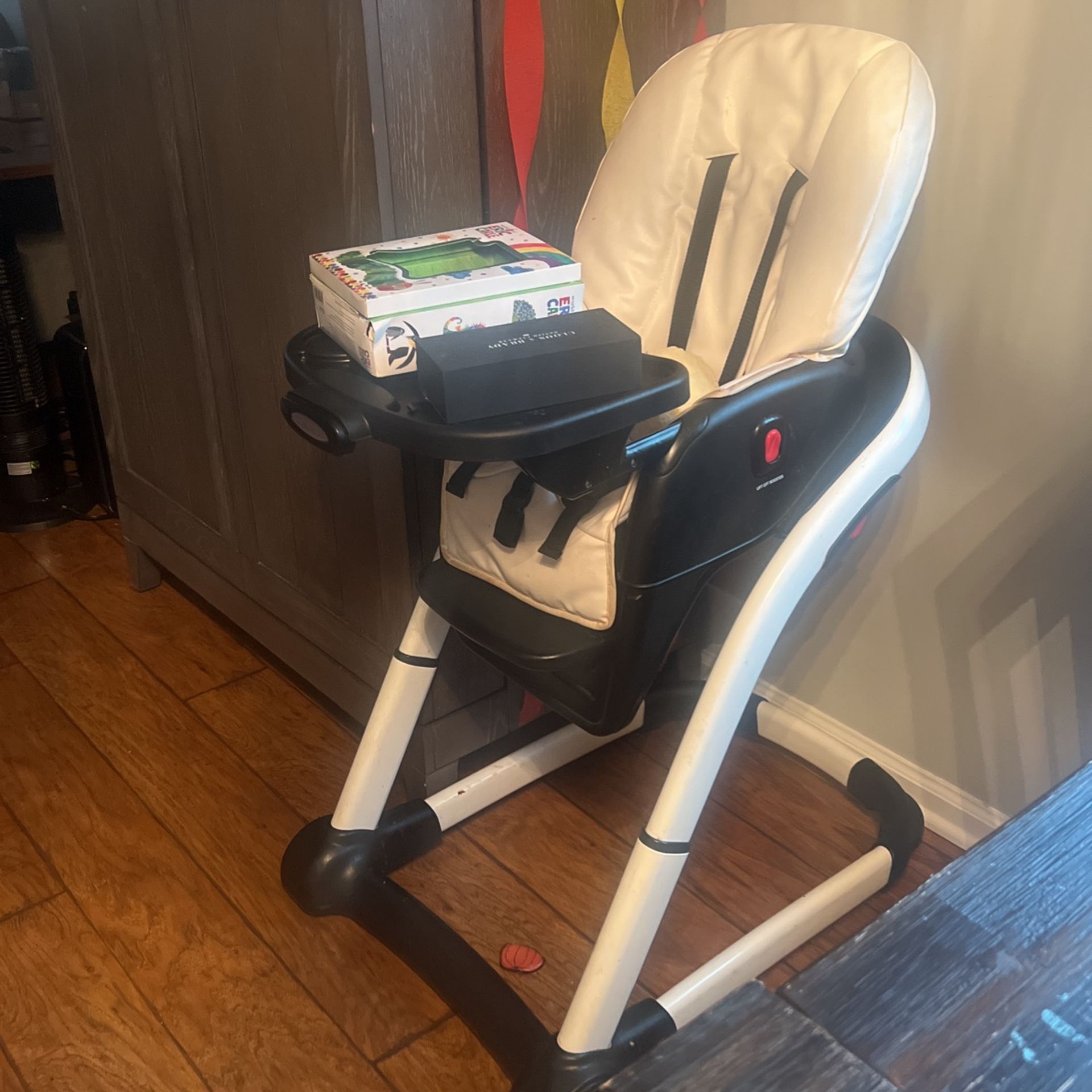 High Chair Alongside Diff Size Trays And Booster Seat