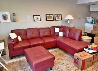 Red leather sectional couch and ottoman