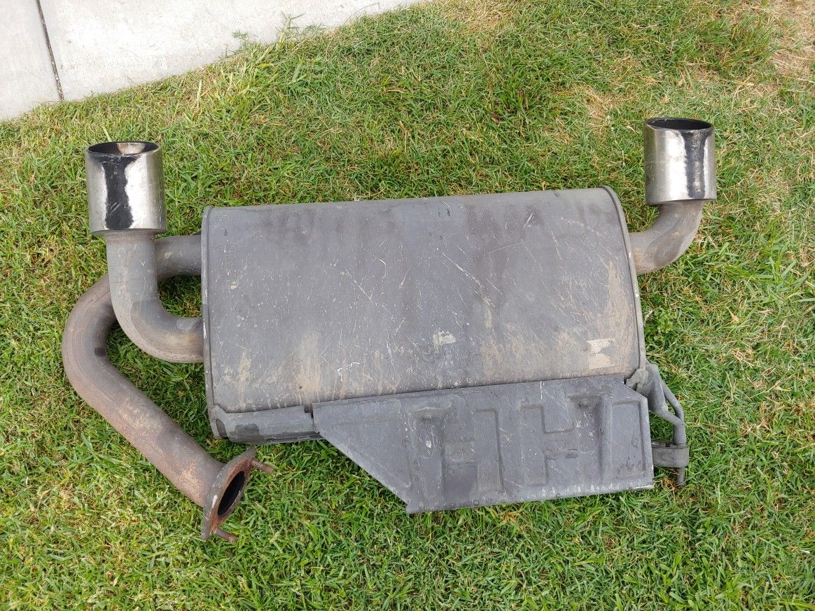 Nissan 350Z OEM muffler with chrome tips and a Borla resonator