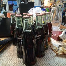 10 Of 15 Set Of Collectoer Coca Cola From.       Soviet Union, Germany,thialand, Spain,Bulgaria, Korea,Pakistan, Sweden, Somalia