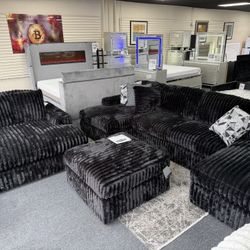 Famous Midnight Madness Set. Sectional $1599 Ottoman $349 Oversize Chaise $999. Delivery Available 