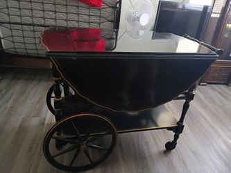 vintage Imperial Grand Rapids tea cart featuring a glass top and drop leaves.