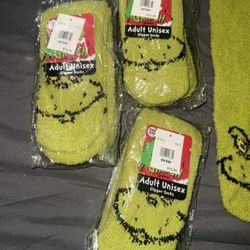 10 pair grinch socks . 3 new and 7 used for Xmas pictures only  Regular price per pair 12.99 selling 10$ each pair 