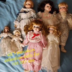 7 Porcelain Collectable Dolls 
