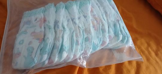 Size 3 swaddlers and water daipers
