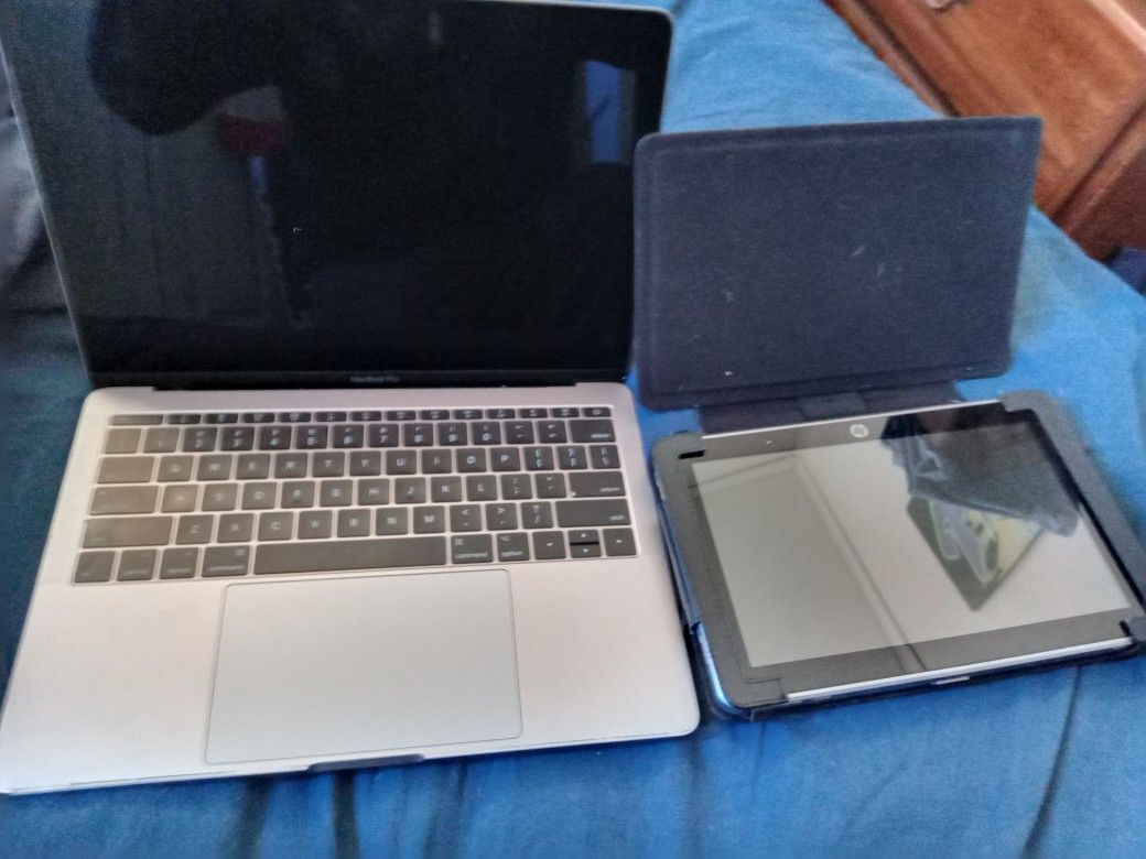 MacBook Pro Laptop And HP Tablet.