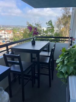 Black table with 4 chairs