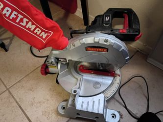 Craftsman compound miter saw equipped with a "Laser Trac" alignment system.