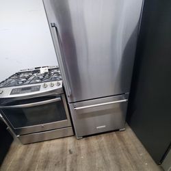 kitchen aid botton freezer  and slide in stove 30 inches great condition warranty $1450