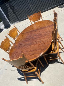 Oak dining room table with 6 chairs