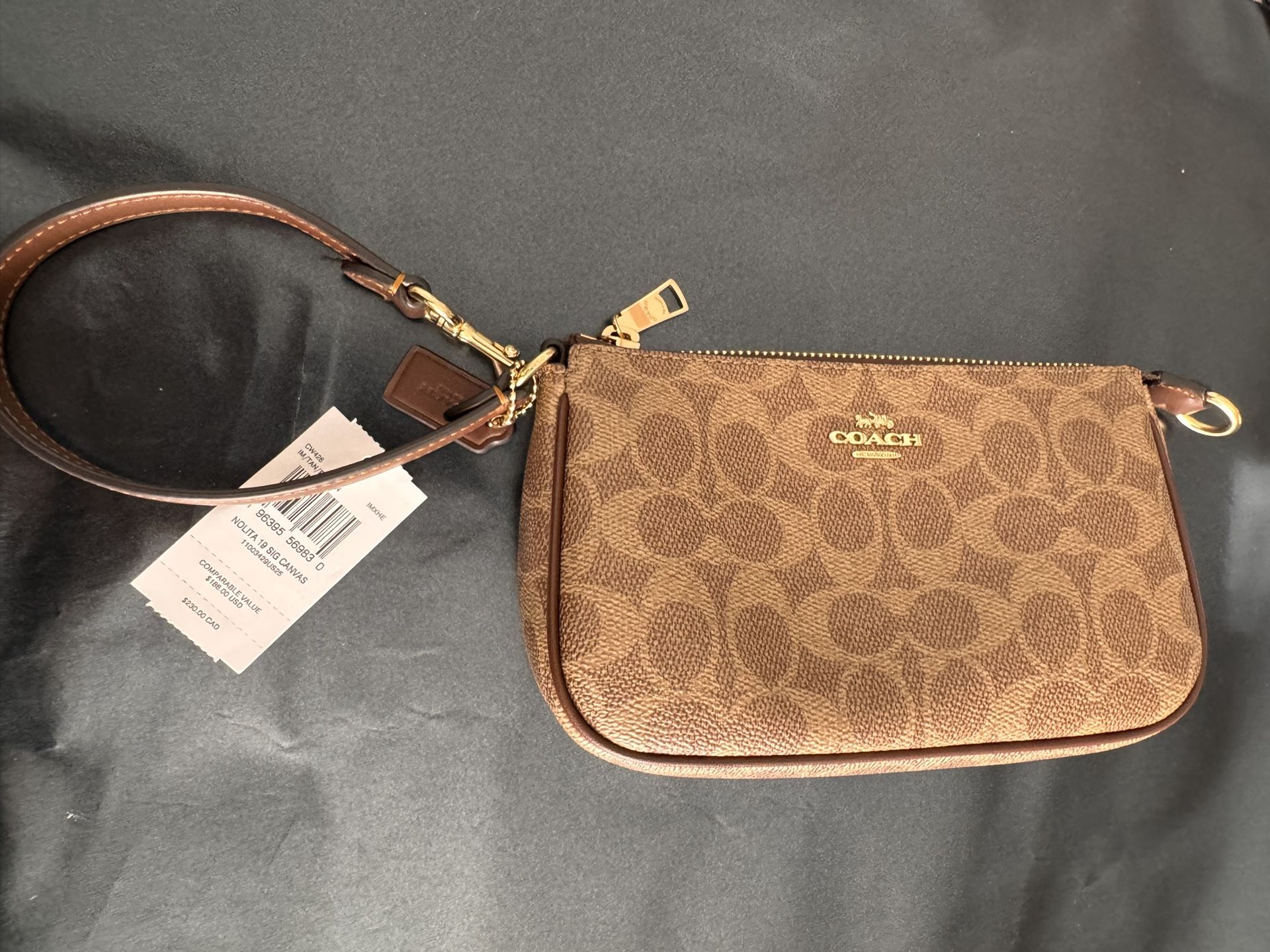 Norita Signature Coach Under Arm Or Wrislet Bag