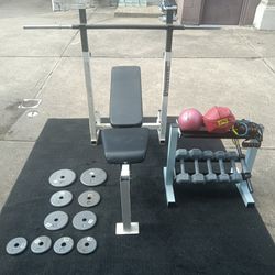 Great home gym set for anyone of all ages 

60 lbs in Dumbells 
50 lbs brand new plates 
Barbell adjustable bench 
Other fitness items included on rac