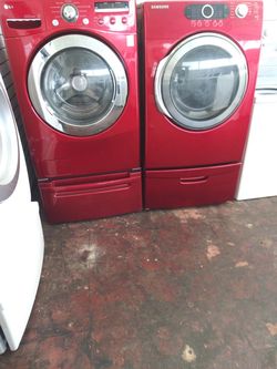 Front load washer LG and electric dryer Samsung set with pedestals in excellent conditions