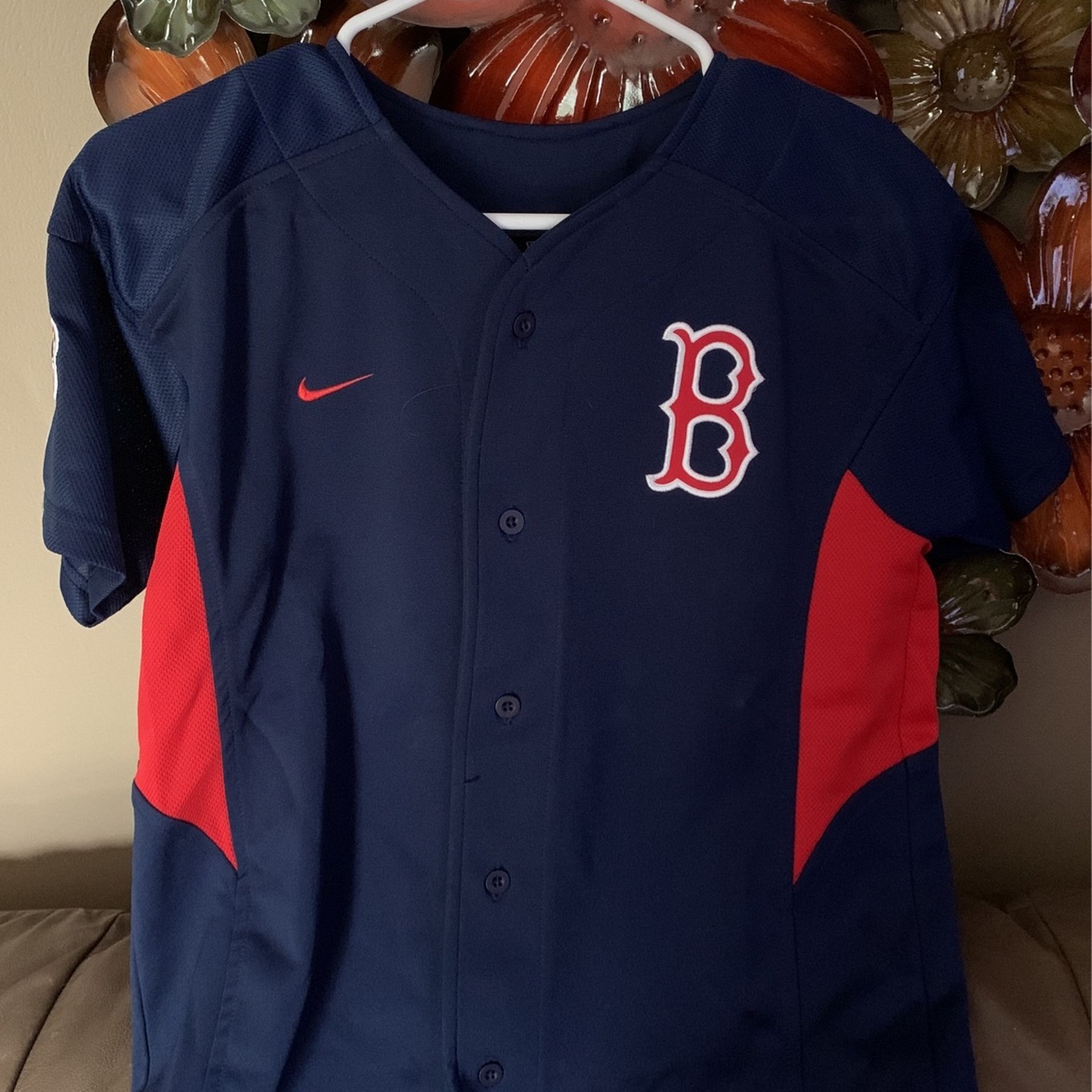 Youth medium Boston Red Sock jersey This jersey is embroidered it’s made by Nike