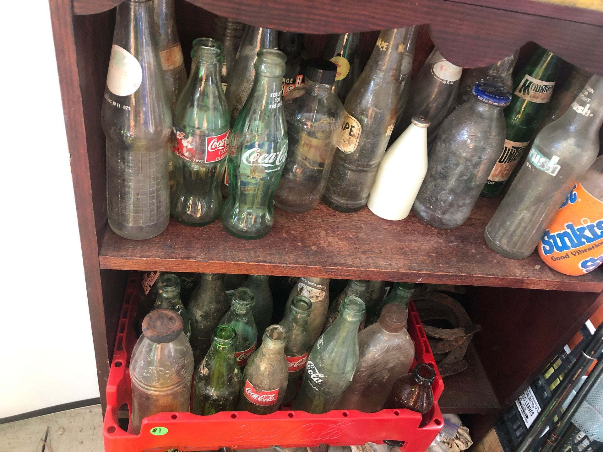 Old license plates and old coke soda bottles ask me about the price