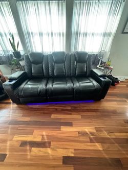 Black Leather Reclining Sofa with LED Lights and Adjustable Coffee table