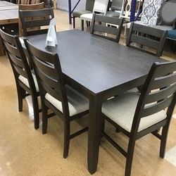 Rokane Brown Dining Table and Chairs (Set of 7) 