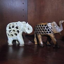 Set of two intricately carved elephant figurines