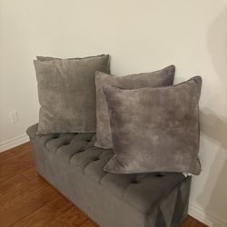 Modern grey velvet storage ottoman with hidden shoe compartments and spacious interior storage