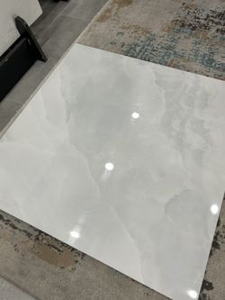 Polished porcelain tile 32x32 and 24x48 available. 