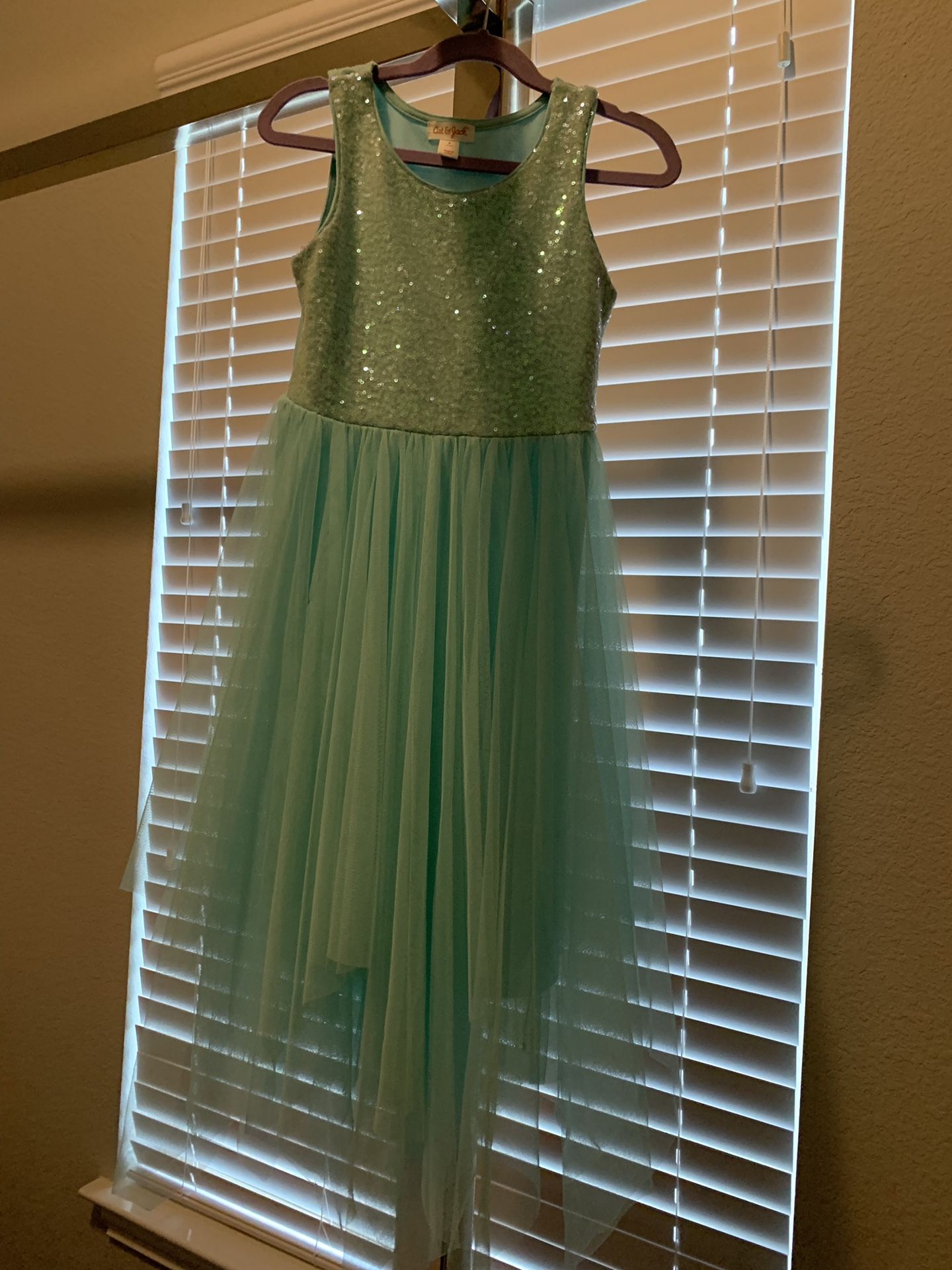 Girl’s dressy dress in teal with sequins design. Size Small. Worn once for wedding.