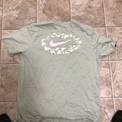 Nike green tee with pink logo.