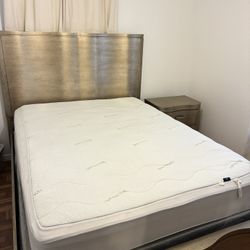 Queen bed with mattress and nightstand