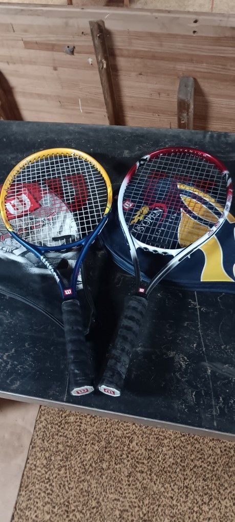 Two Wilson Titanium tennis rackets w/covers