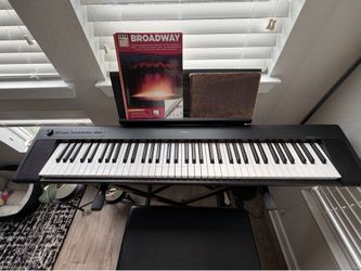$200 Electric Keyboard, Chair, and How-To-Play Books
