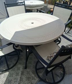 Nice strong concrete table with  4 chairs umbrella holder