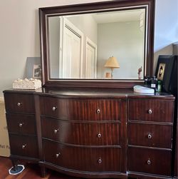 Dark wood dresser with mirror from Walter E Smithe