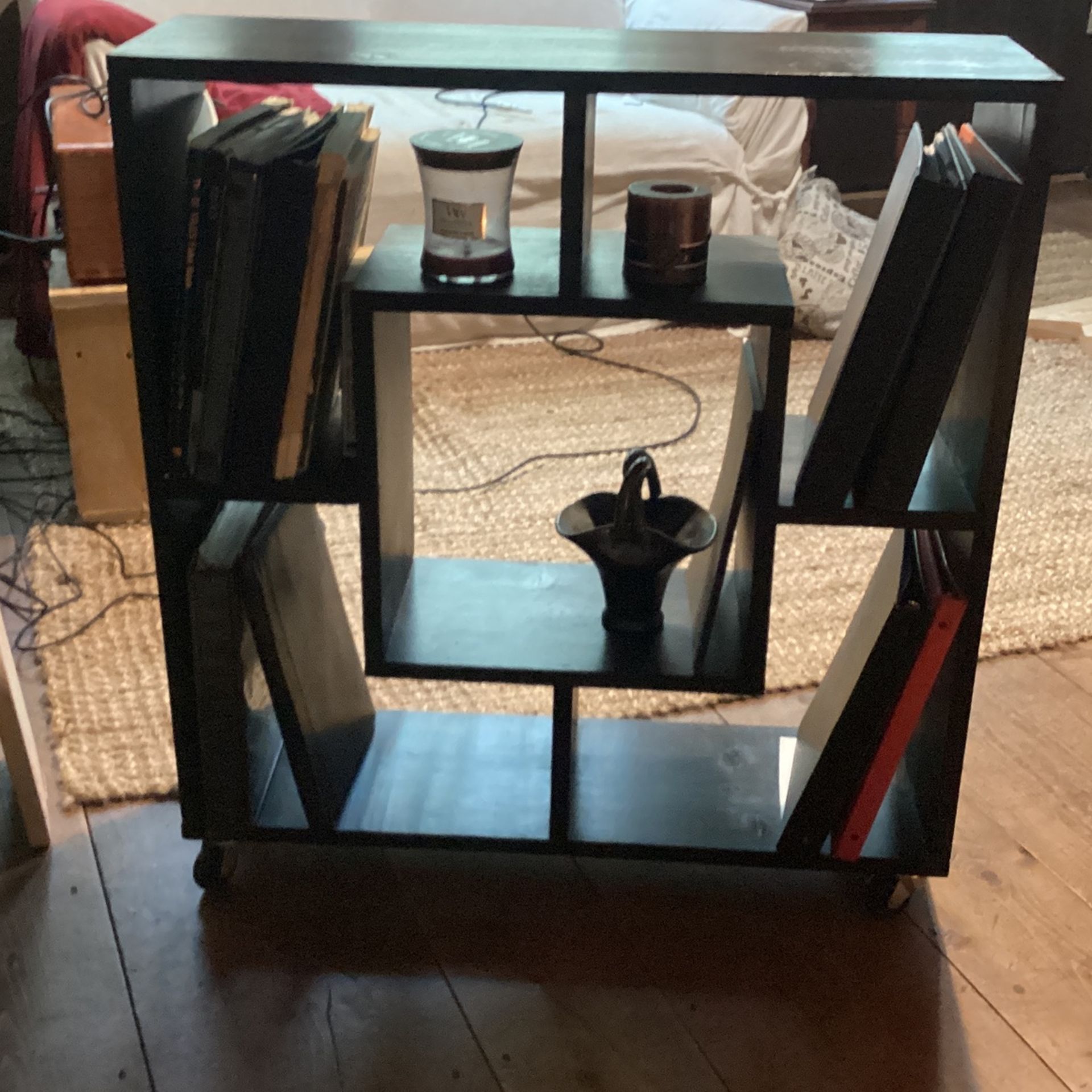 Black Wooden Shelf Unit On Casters