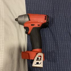 The image shows a Milwaukee 2755-20 M18 FUEL Compact Cordless Impact Wrench