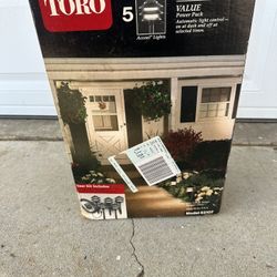 Never use Toro Outdoor light kit.            Tags  Poor palm, tree, patio garden, home, rustic light, flood, light, concrete pathway, stones, home dec