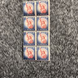 This is a block of eight 8-cent Statue of Liberty postage stamps issued in 1954 as part of the Liberty Series. 
