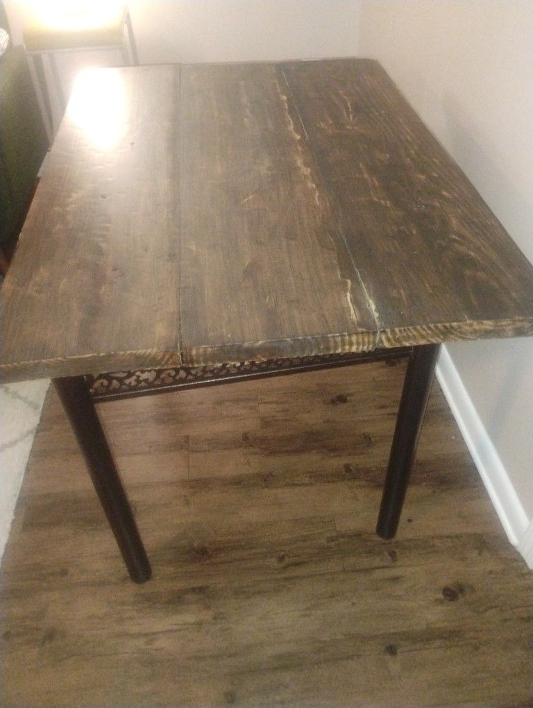 100 year old reclaimed farmhouse dining table with refurbished metal bottom