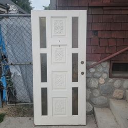 Wooden Entry Door With Four Vertically Embosed Floral Panels And Narrow Glass Sidelite Windows 36x77.8