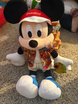 Mickey Mouse toy and dinosaur toy