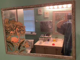 vintage mid-century modern wall mirror featuring pink flamingos and tropical landscape design