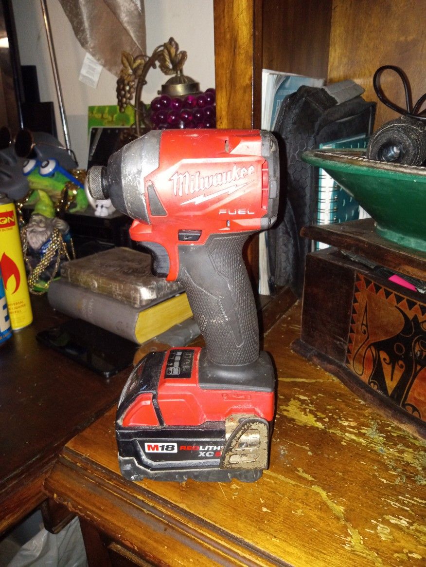 Milwaukee Fuel Impact Drill With A M18. Red Lithium Big Size Battery