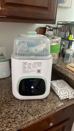 Momcozy bottle sterilizer like new