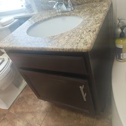 Cabinet and granite top with sink 24"