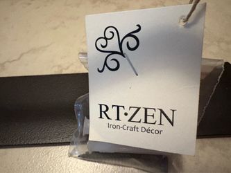 Wrought-iron towel holder. Toilet roll holder.