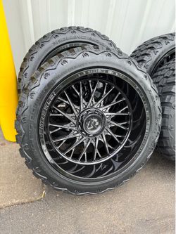 NEW 22x12 gloss black fittipaldi wheels wrapped in 33x12.50r22 RBP tires
