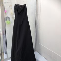 Black spaghetti strap gown with Beading. SIZE 8.